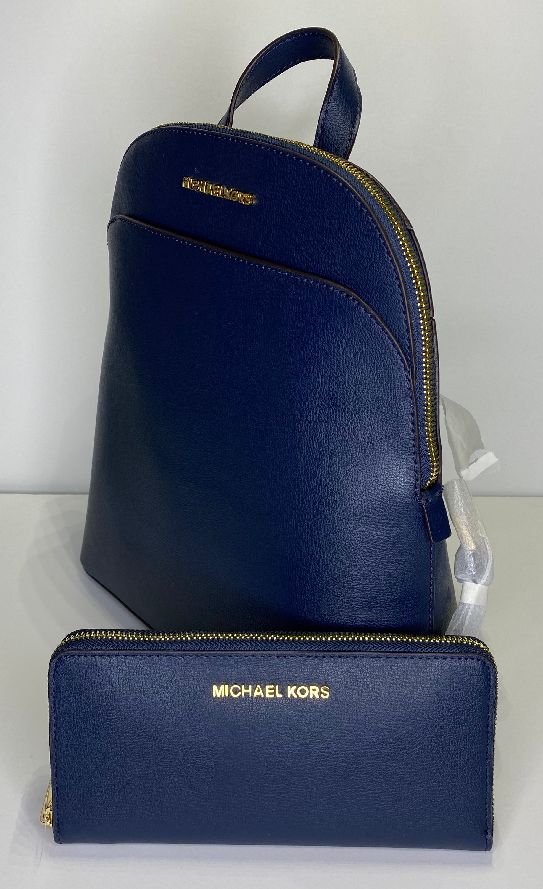MICHAEL Michael Kors Emmy Large Dome Backpack bundled with Michael Kors  Large ZA Continental Wallet Navy